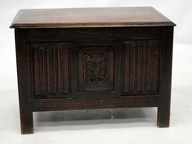 Appraisal: A SMALL OAK COFFER with linen fold decorated panelled front