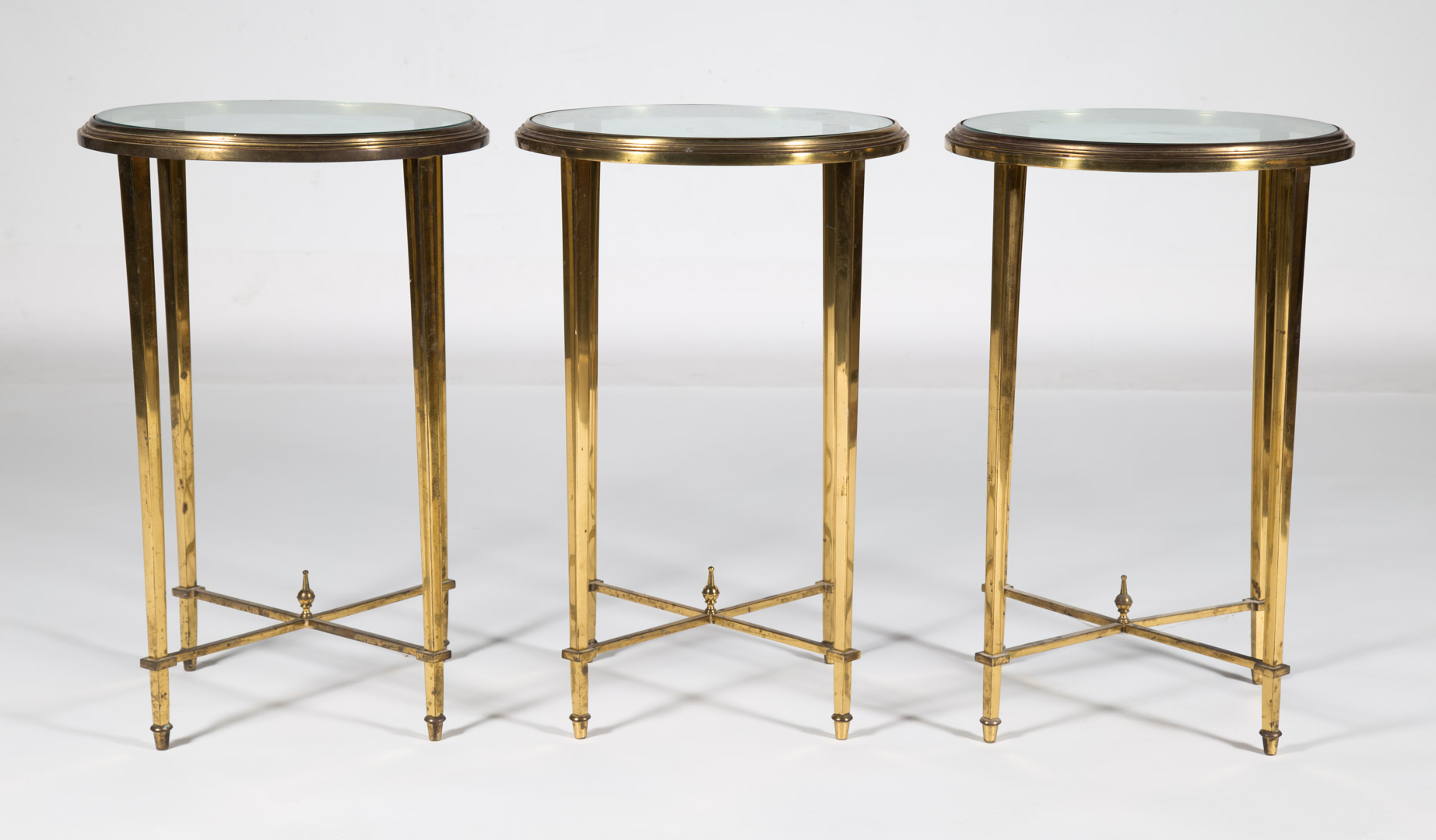 Appraisal: Neoclassical style brass and glass side tables circular form with