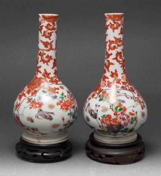 Appraisal: Pair of Japanese floral decorated porcelain bottle-form vases fourth quarter-