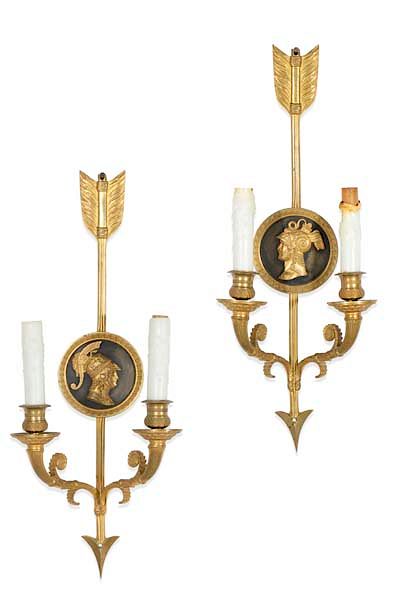 Appraisal: A pair of Empire bronze twin branch wall lights A