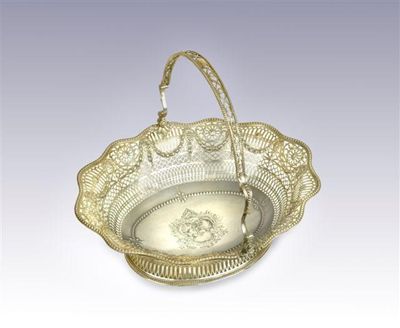 Appraisal: A George III cake basket of shaped oval outline with