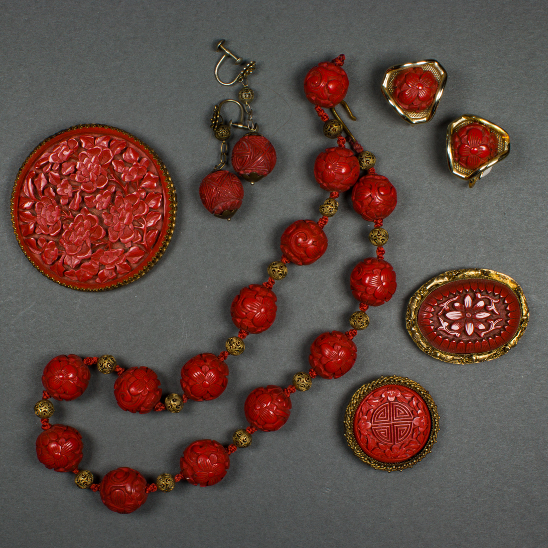 Appraisal: COLLECTION OF CINNABAR LACQUER JEWELRY ITEMS Collection of cinnabar lacquer