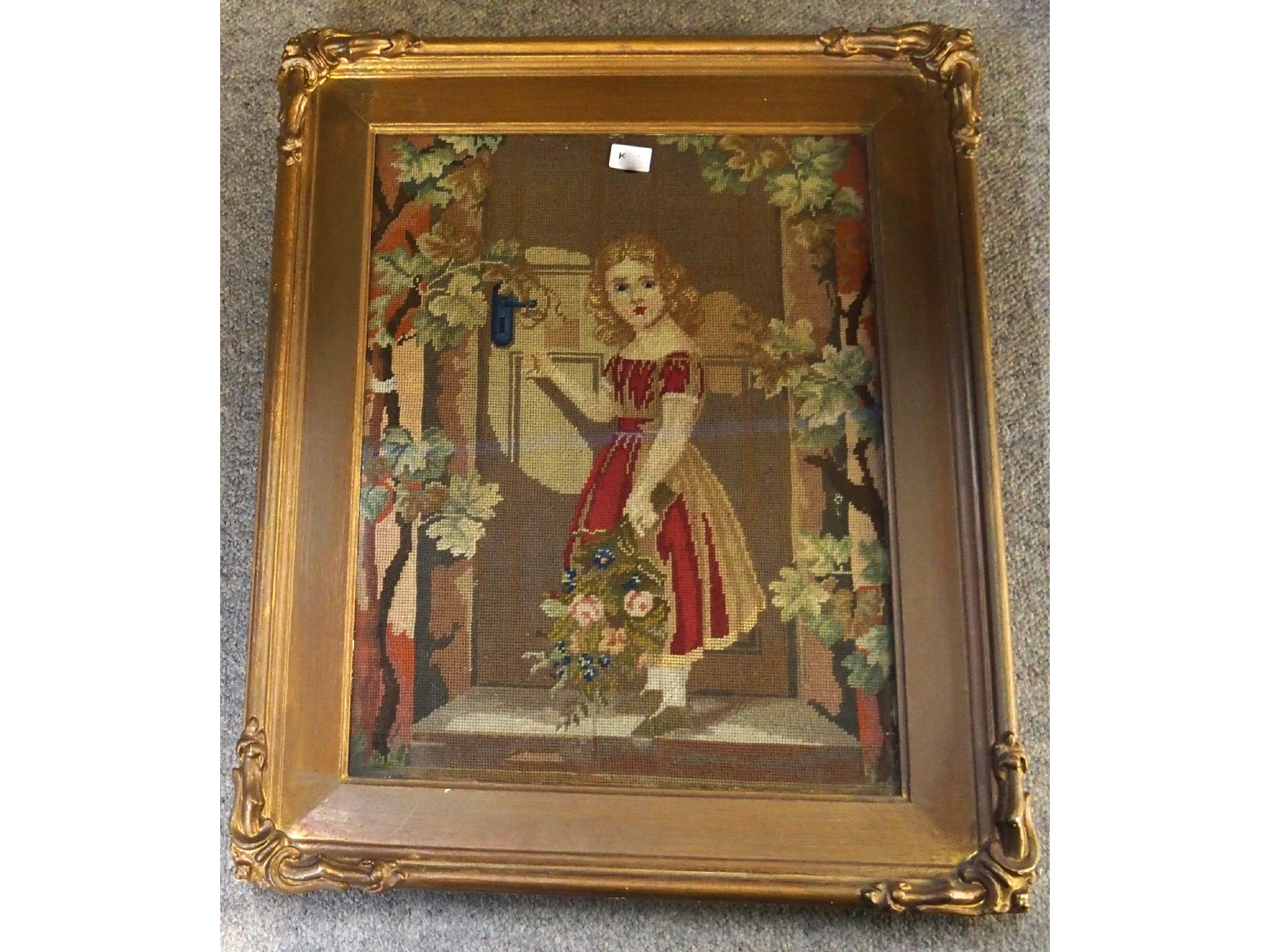 Appraisal: A framed embroidery of a little girl delivering flowers