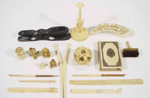 Appraisal: Collection of ivory items including a puzzle ball on stand