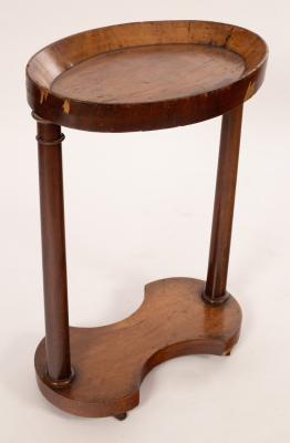 Appraisal: An early Victorian mahogany washstand the dished oval top on