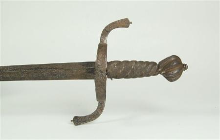 Appraisal: A th century English broad sword the spiral wooden grip