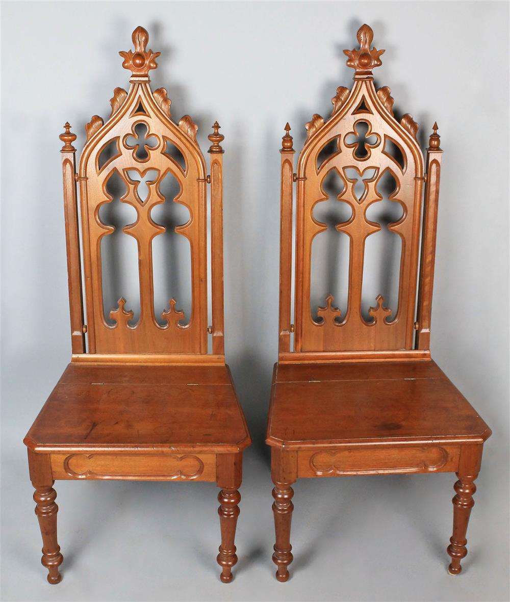 Appraisal: TWO SIMILAR GOTHIC REVIVAL WALNUT SIDE CHAIRS the arched crest