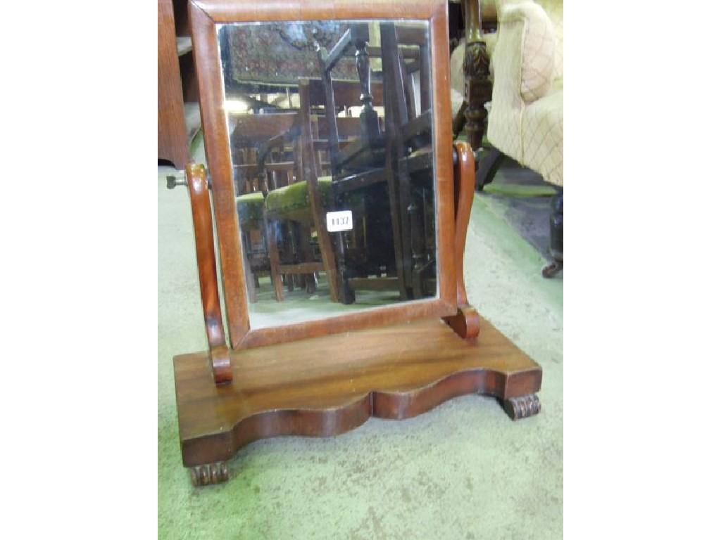 Appraisal: A Victorian mahogany toilet mirror with shaped platform base