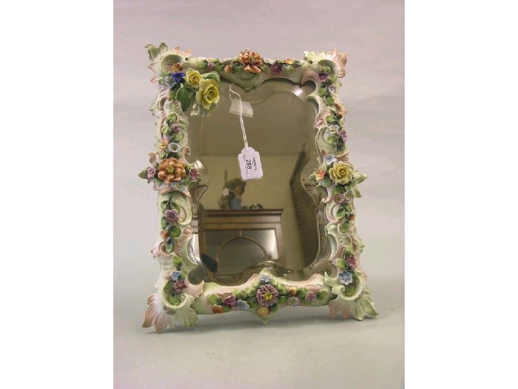 Appraisal: A Sitzendorf-type porcelain dressing mirror rectangular-shape encrusted with bright flowers