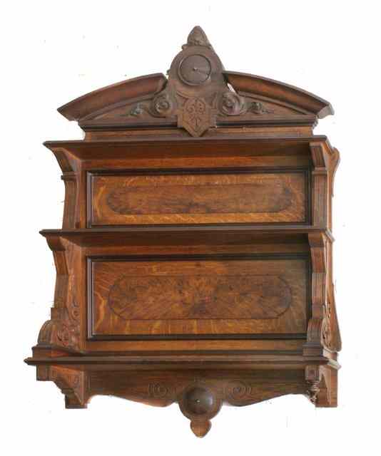 Appraisal: A VICTORIAN OAK WALL SHELF with carved break arch pediment