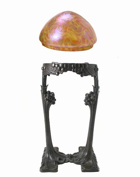 Appraisal: A Jugendstil style bronze and Loetz style iridescent glass lamp