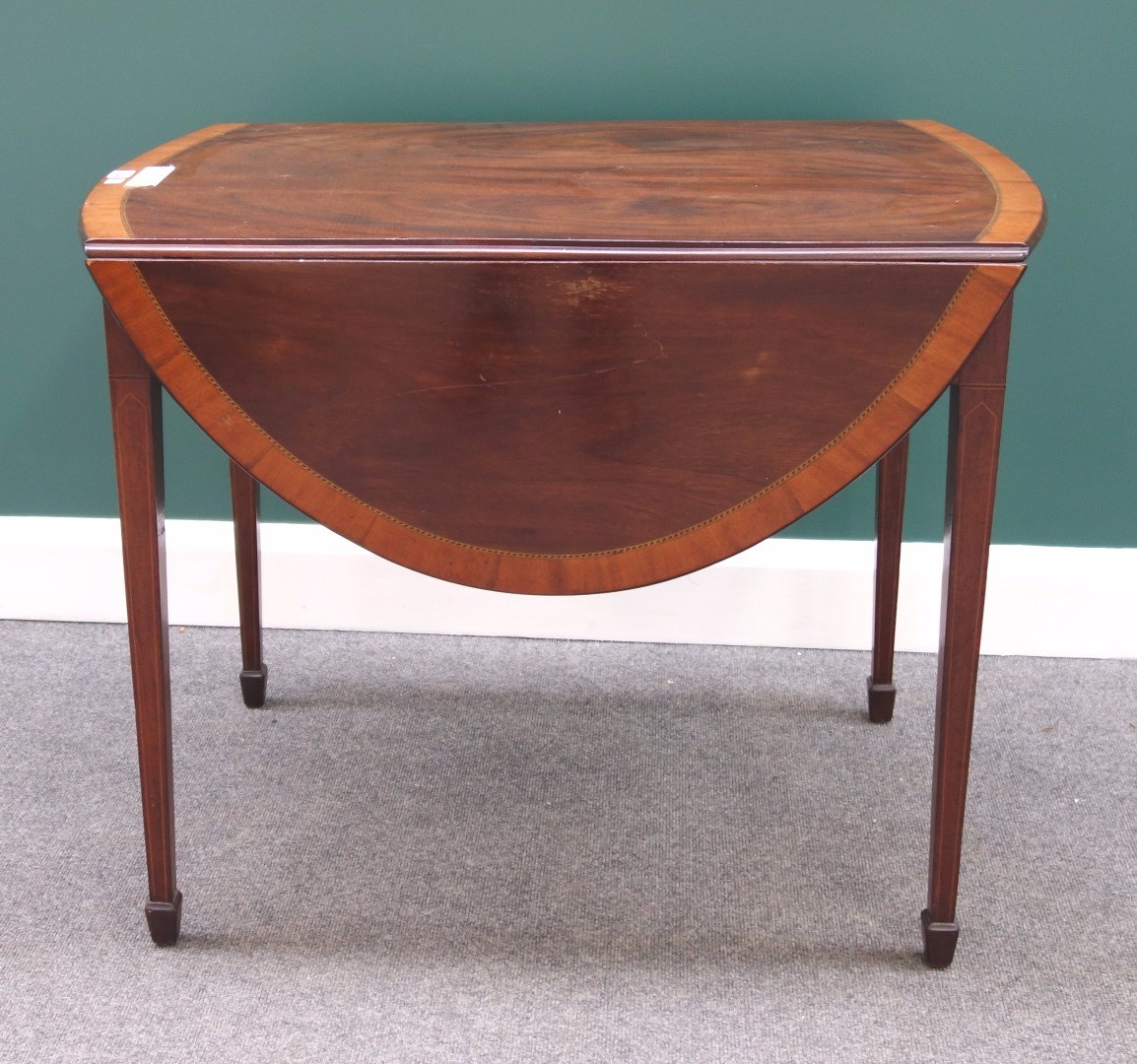 Appraisal: A George III inlaid mahogany Pembroke table with bow frieze