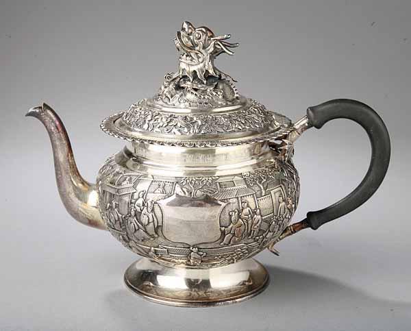 Appraisal: A Silverplate Teapot the domed lid with a large grotesque