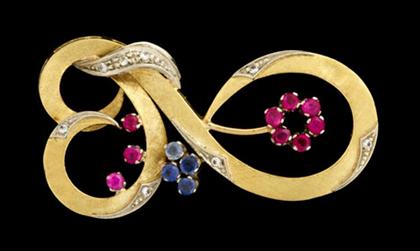 Appraisal: karat white gold ruby sapphire and diamond swirl brooch Scroll