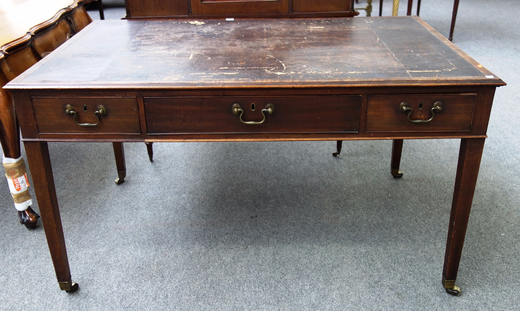 Appraisal: A George III style mahogany centre writing table with an