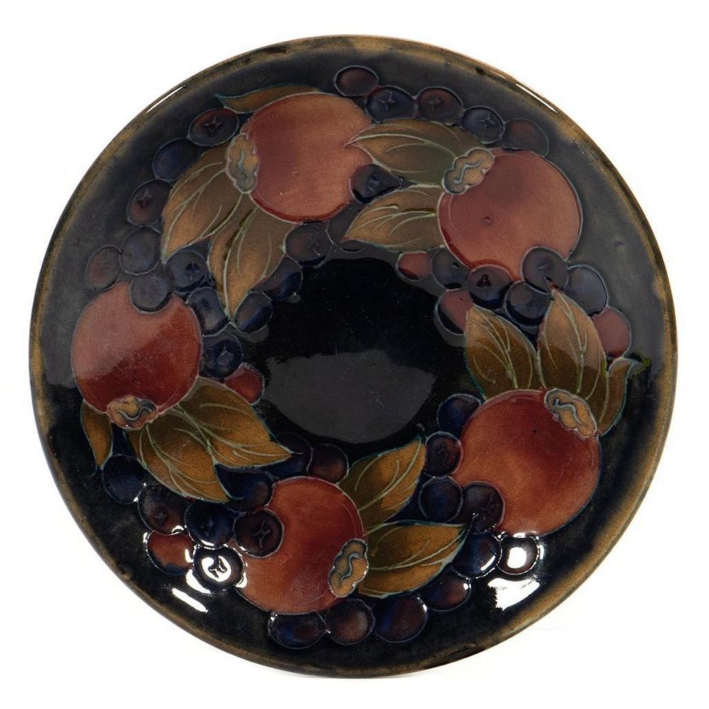 Appraisal: Moorcroft Pottery Saucer decorated with Peaches and Berries in cm