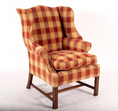 Appraisal: A George III style wingback armchair on chamfered front legs