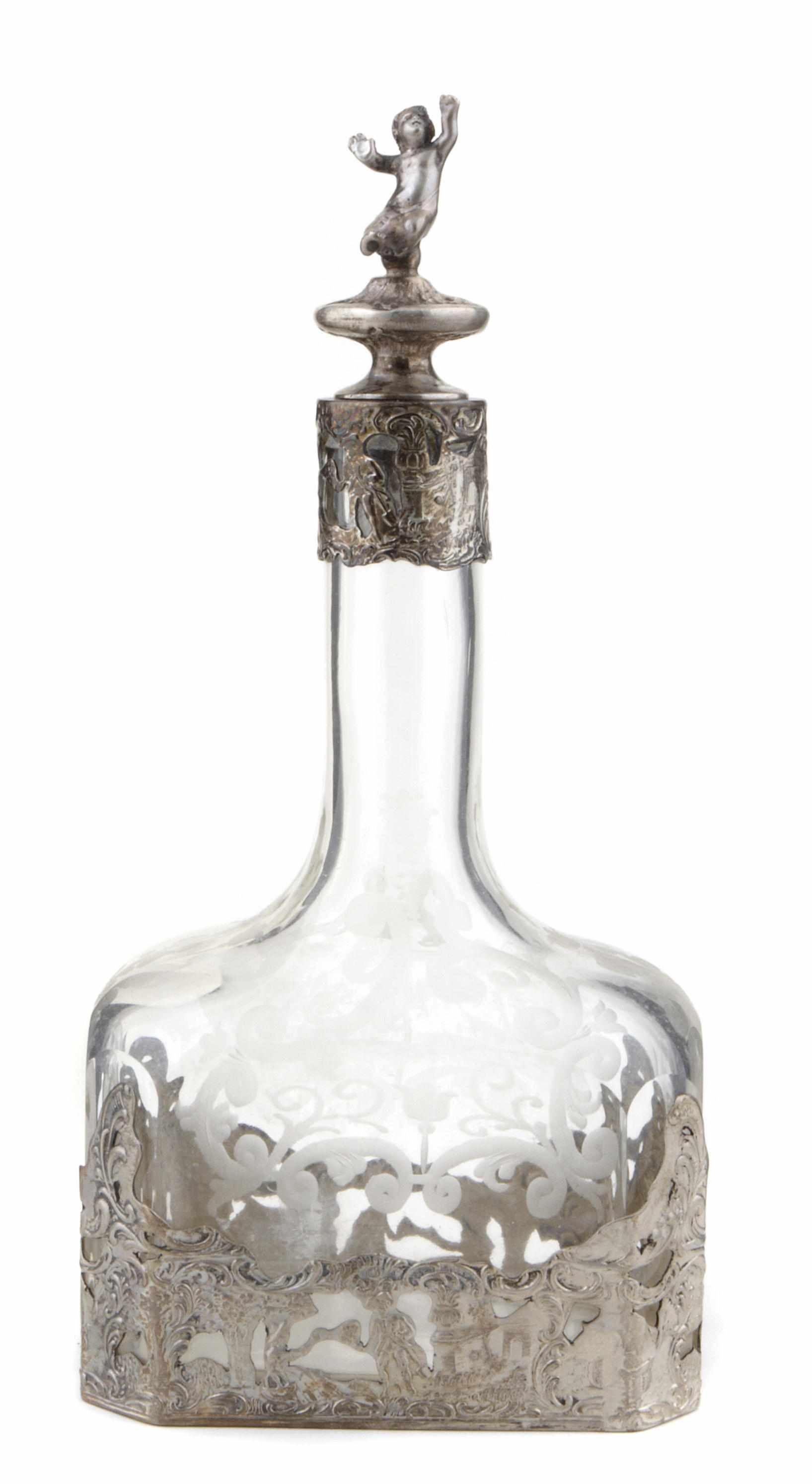 Appraisal: A German standard silver mounted glass liqueur decanter with figural