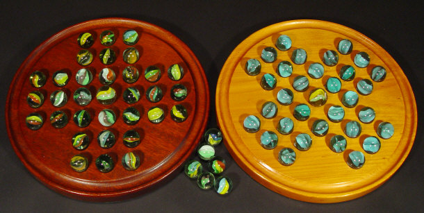 Appraisal: Two turned wooden solitaire boards and a collection of glass