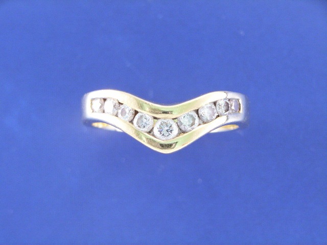 Appraisal: An ct gold nine diamond channel set dress ring estimated