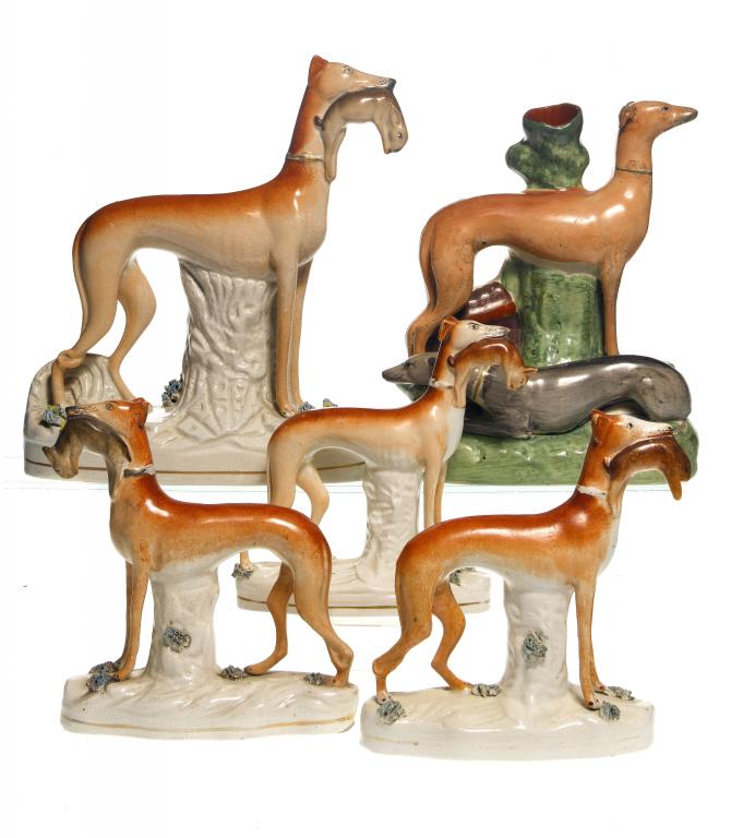 Appraisal: FIVE STAFFORDSHIRE EARTHENWARE MODELS OF GREYHOUNDS one a spillholder group