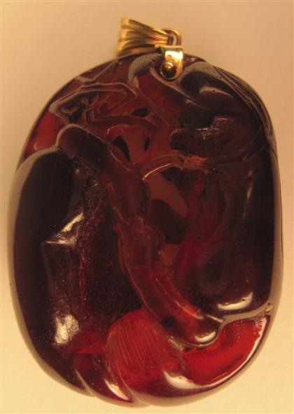 Appraisal: Chinese carved amber pendant th th century