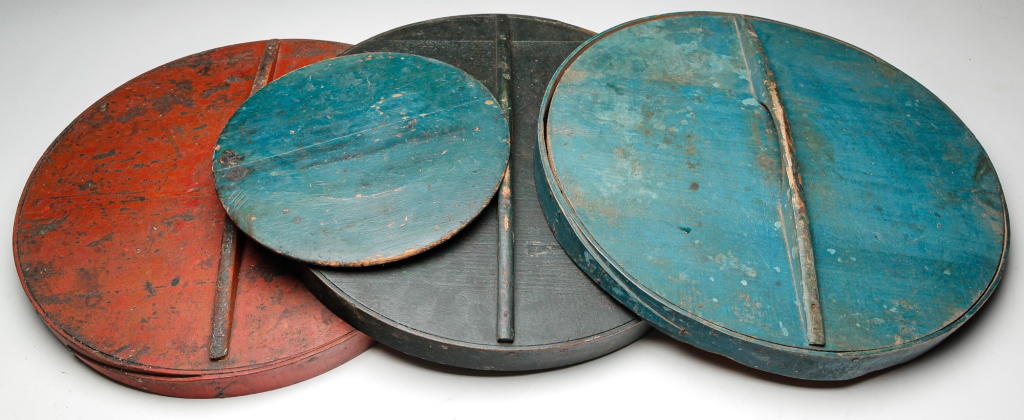 Appraisal: FOUR AMERICAN PAINTED LIDS Second half th century pine Three