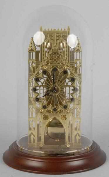 Appraisal: Miniature Cathedral Skeleton Clock Description th century Under glass dome