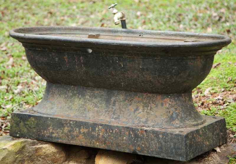 Appraisal: th Century Cast Iron Urn Baseused as a watering trough