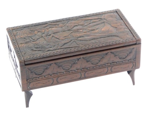 Appraisal: An Eastern carved wooden casket decorated to the hinged lid