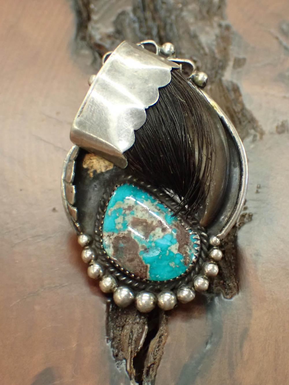 Appraisal: SOUTHWEST NATIVE AMERICAN RING having silver turquoise and a bear