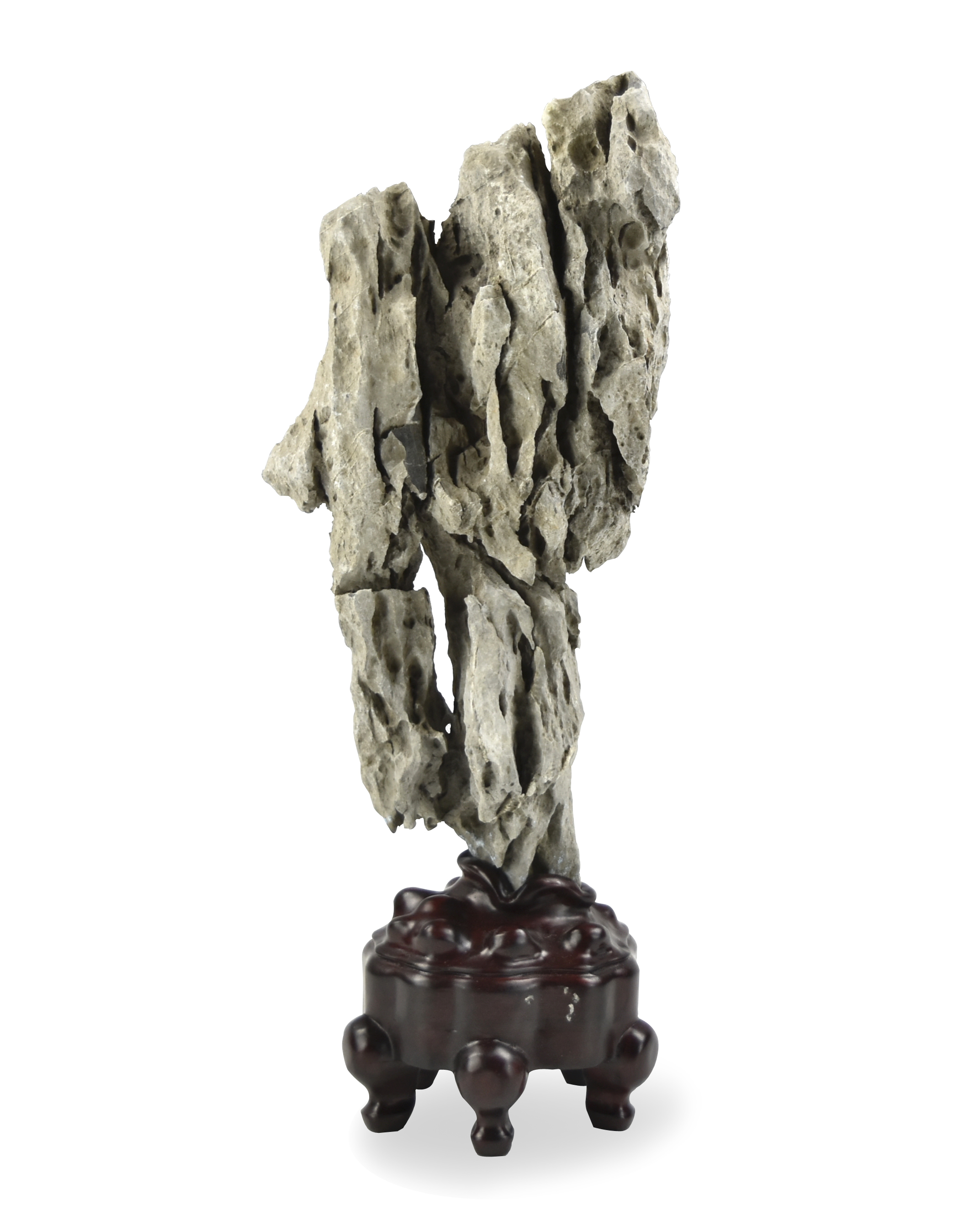 Appraisal: a Chinese large scholar rock with a stand supported on