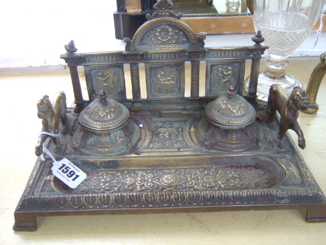 Appraisal: A Victorian brass inkwell the two lidded recesses flanked by