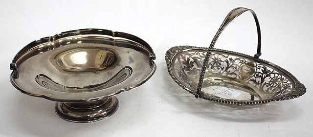 Appraisal: A SILVER TAZZA with a looped handle and a shaped