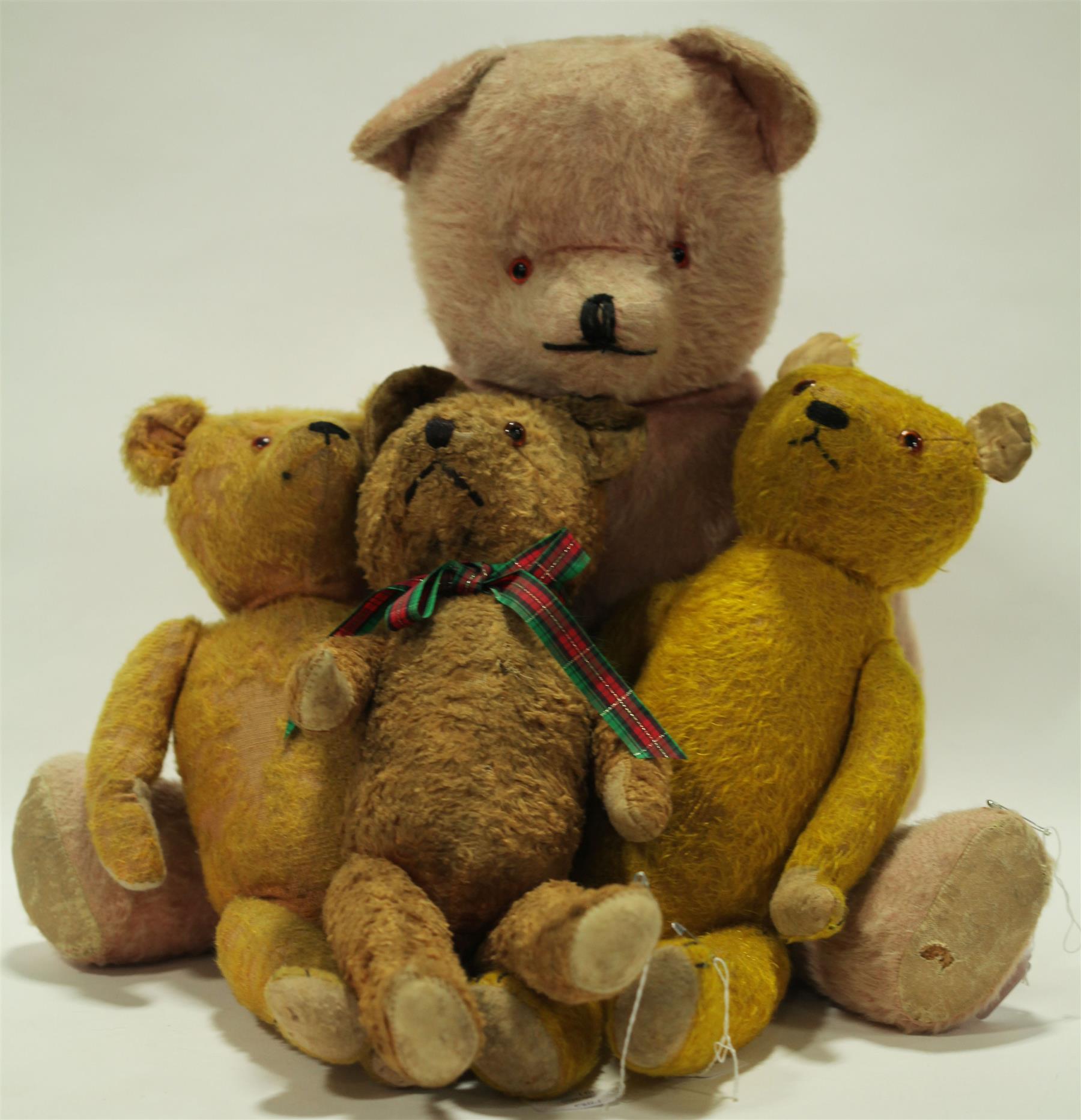 Appraisal: FOUR MOHAIR BEARS American-German early-mid th century The golden bear