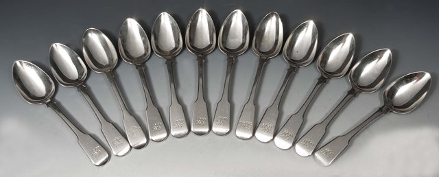 Appraisal: A SET OF TWELVE FIDDLE PATTERN SILVER DESSERT SPOONS monogrammed