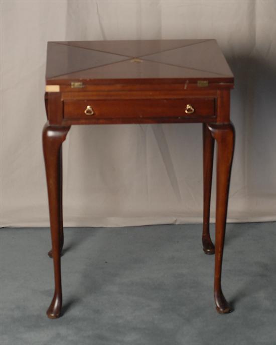 Appraisal: A Mahogany Handkerchief Fold Game Table having a swivel top