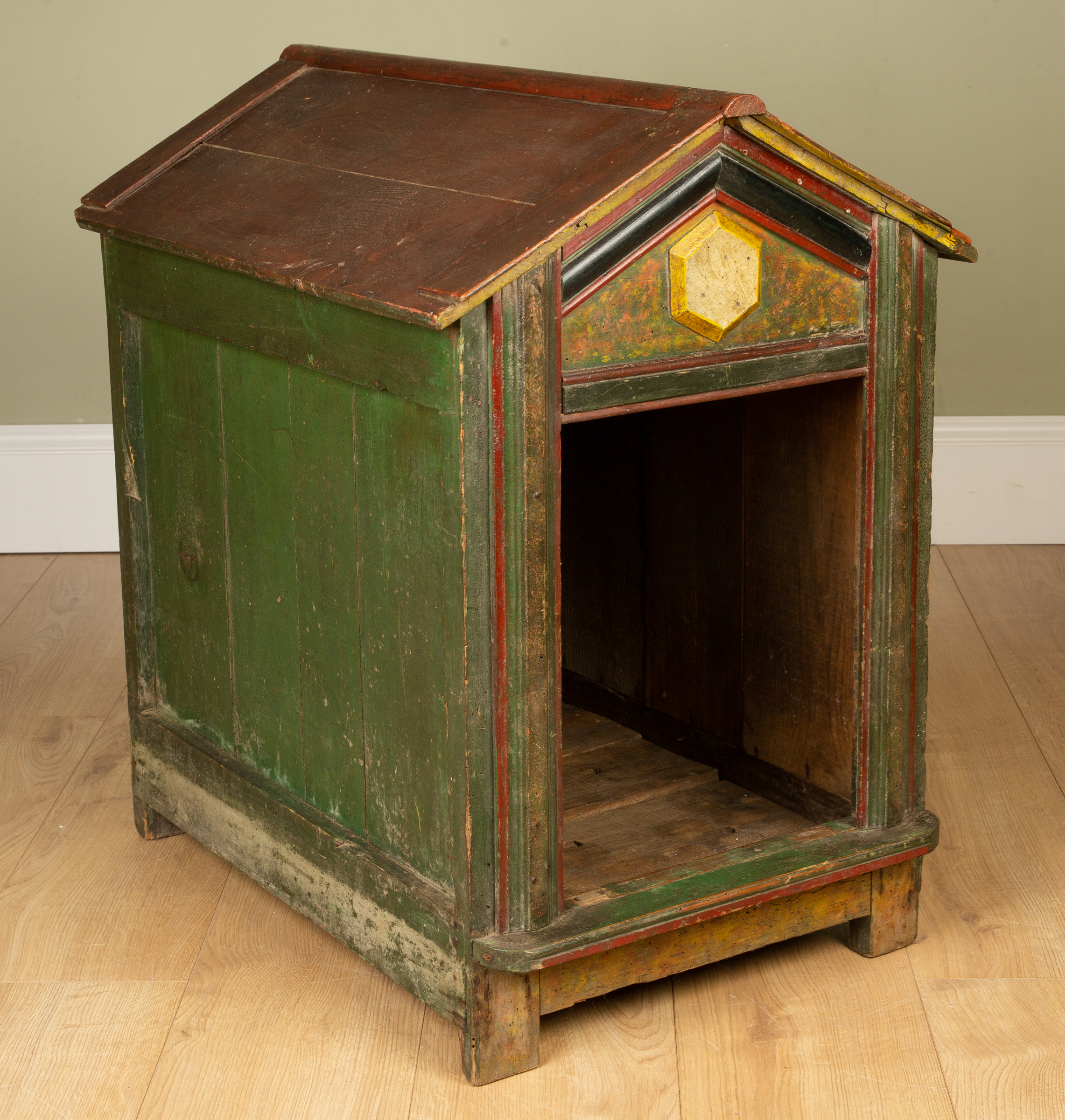 Appraisal: An antique painted wooden dog kennel with pitched roof standing