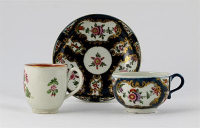 Appraisal: A Worcester teacup and saucer painted with polychrome flower garlands