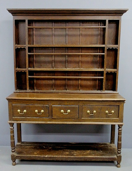 Appraisal: Welsh style oak dresser the upper section with open shelves