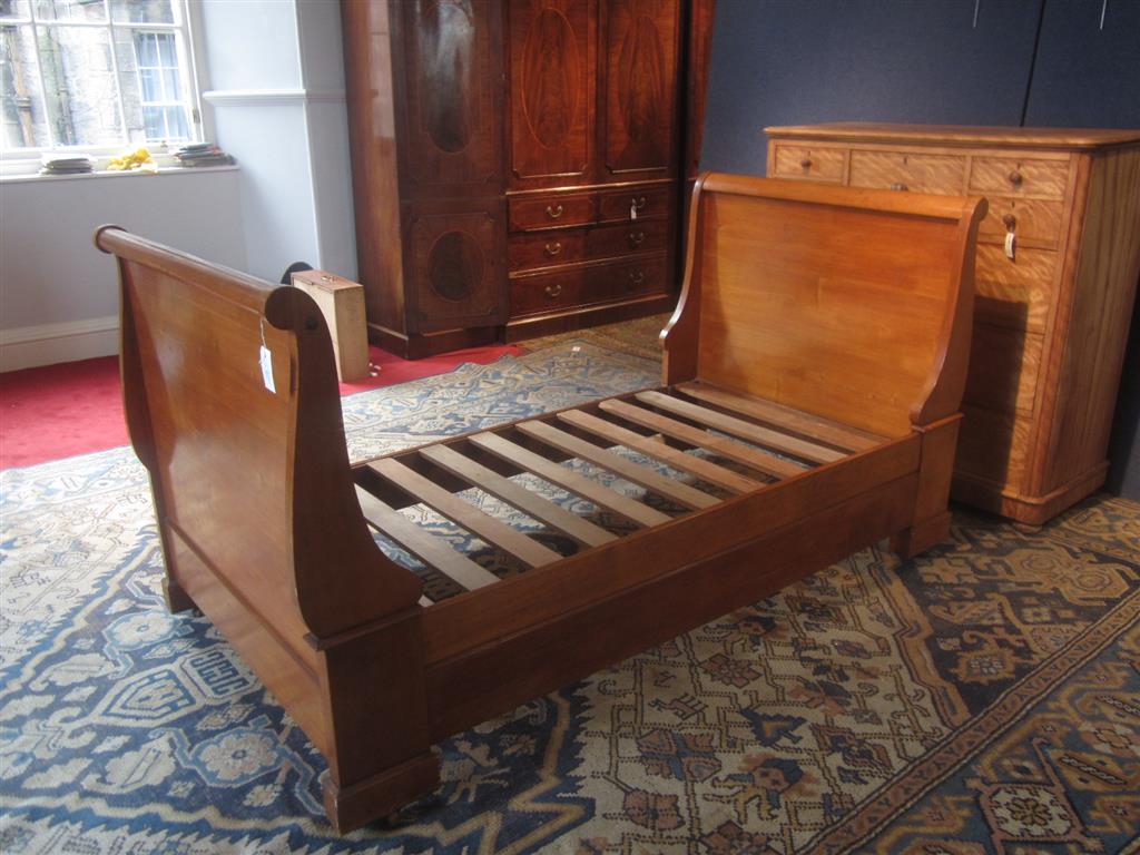 Appraisal: FRENCH WALNUT SINGLE BATEAU LIT TH CENTURY with scrolled head