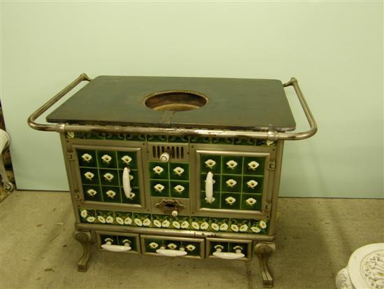 Appraisal: Highly decorative early th century cast metal and tiled stove