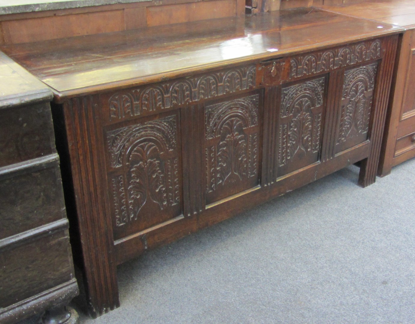 Appraisal: A large th century and later oak coffer with carved