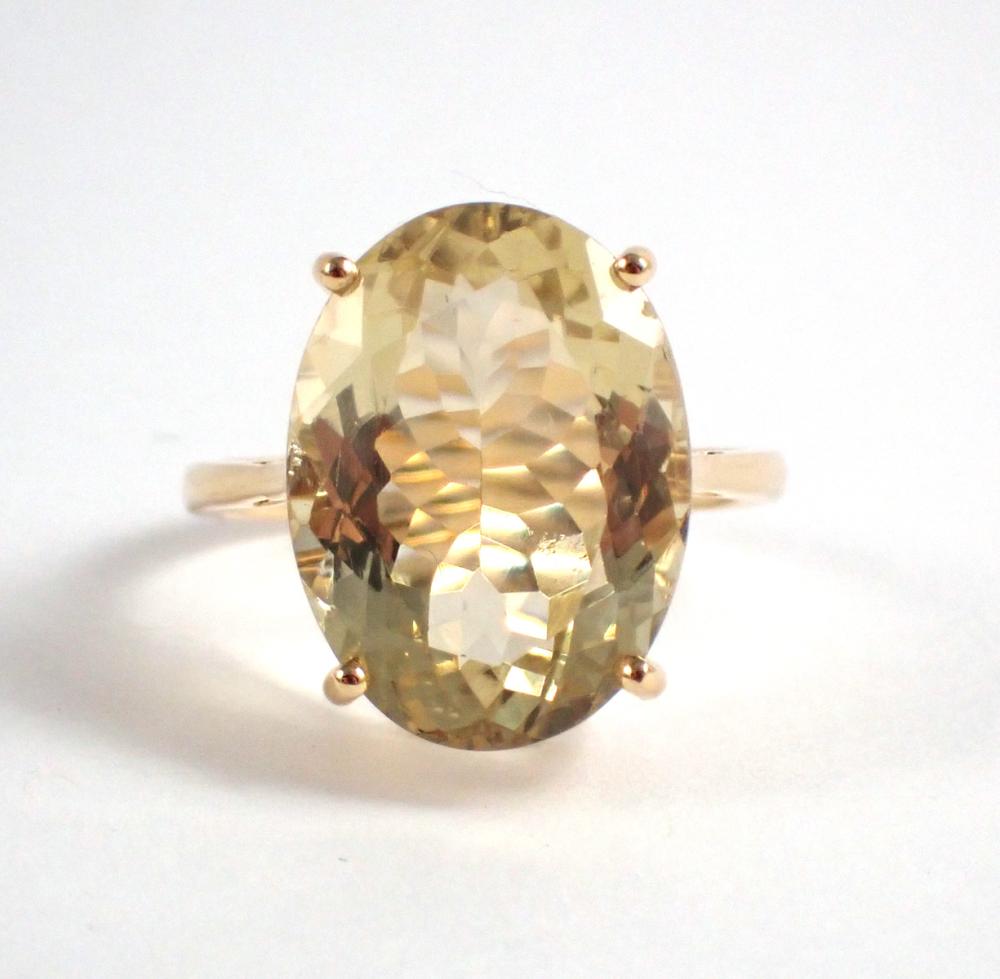 Appraisal: YELLOW LABRADORITE AND FOURTEEN KARAT GOLD RING with four yellow