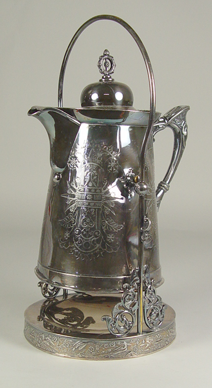 Appraisal: Victorian Silverplate Water Pitcher Circa pitcher in swinging stand x