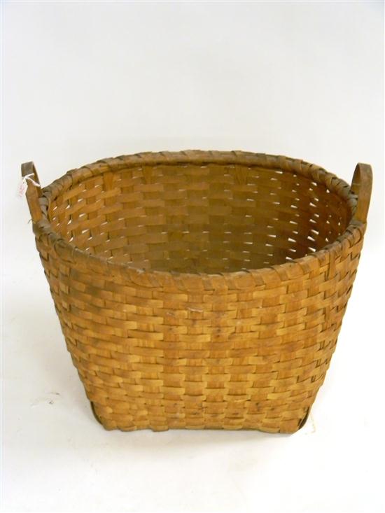 Appraisal: Double carrying handled basket '' h