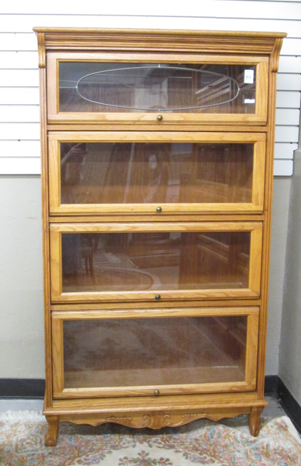 Appraisal: VICTORIAN STYLE FOUR-SECTION 'STACKING' OAK BOOKCASE Kenwood Mfg Co Santa