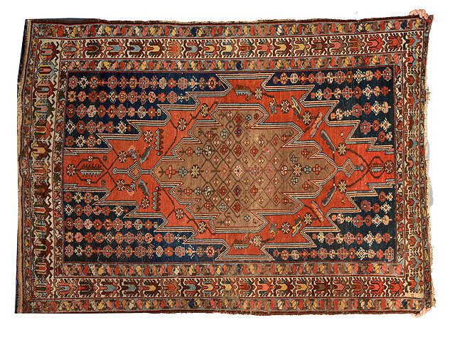 Appraisal: A MAZLAGHAN RED GROUND CARPET with stylised diamond design to