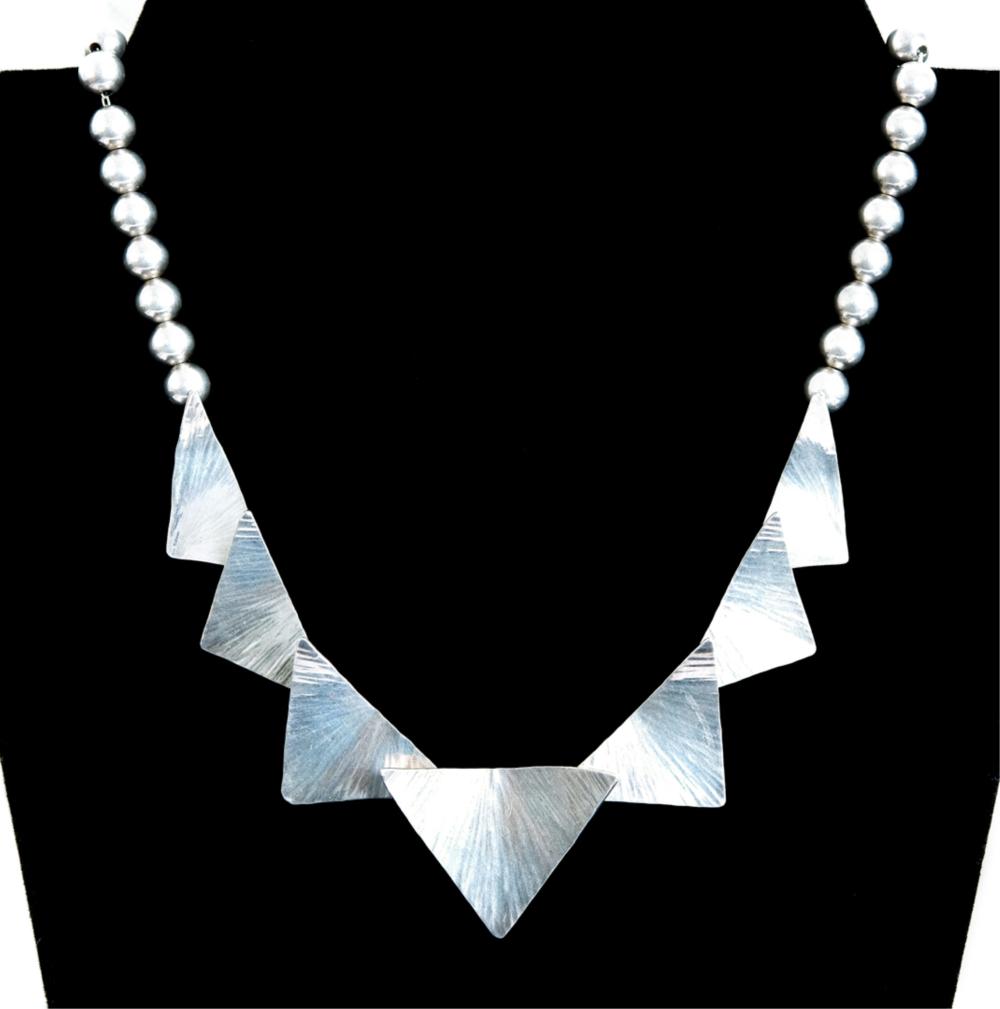 Appraisal: STERLING SILVER TRIANGLE BEAD NECKLACESterling silver necklace with triangle and