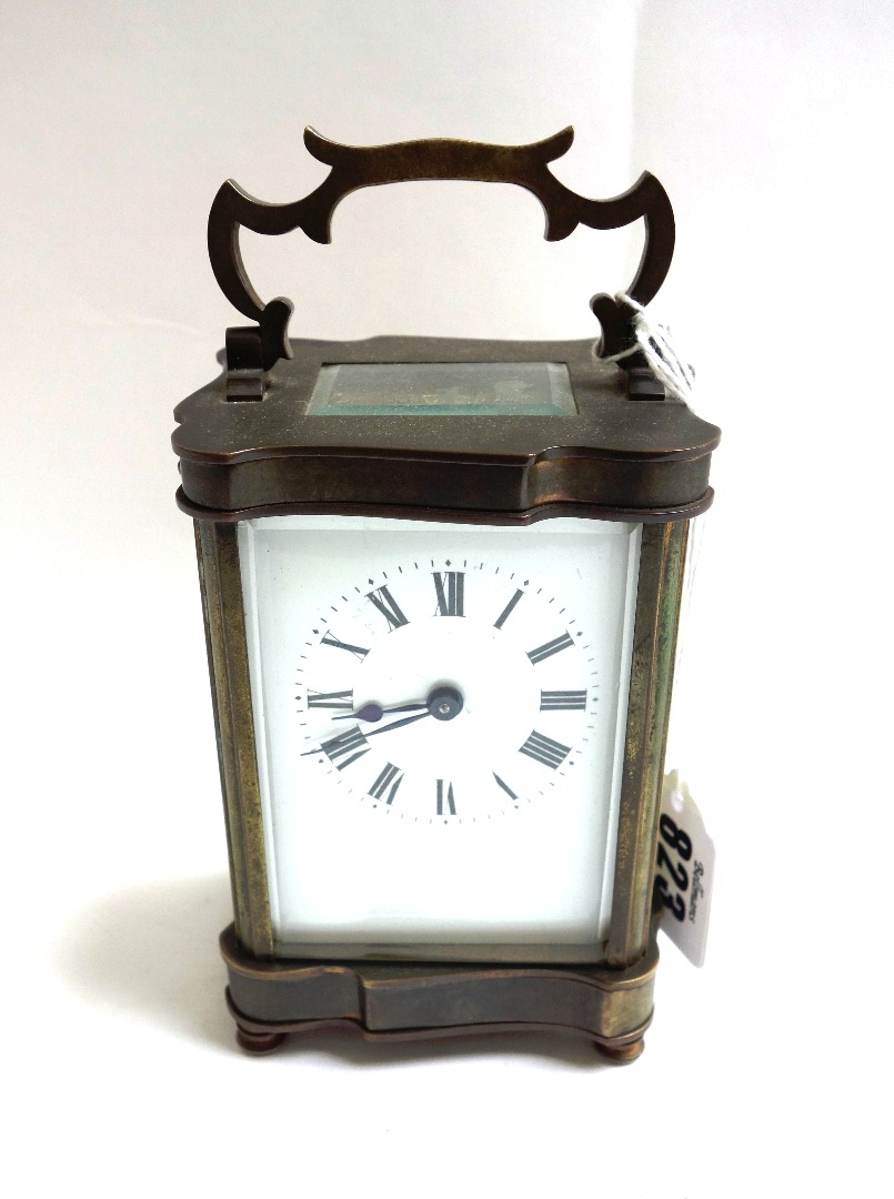 Appraisal: A brass cased carriage clock late th century with shaped